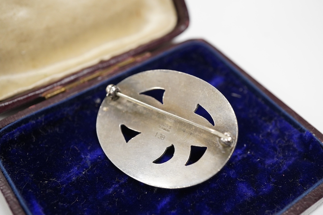 A Georg Jensen 925S and single stone cabochon garnet set oval brooch, design no. 138, 38mm.